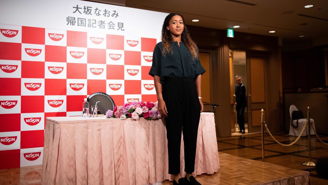 Japan's Naomi Osaka, the US Open women's singles tennis tournament champion, attends a press conference at a hotel in Yokohama on September 13, 2018.