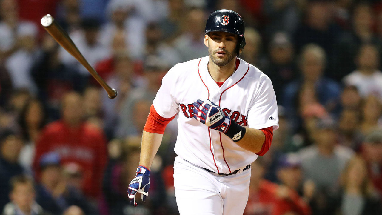 BOSTON, MA - SEPTEMBER 12: J.D. Martinez #28 of the Boston Red Sox tosses his bat walking to first during the eighth inning against the Toronto Blue Jays at Fenway Park on September 12, 2018 in Boston, Massachusetts.