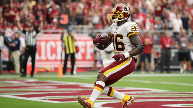 GLENDALE, AZ - SEPTEMBER 09: Running back Adrian Peterson #26 of the Washington Redskins scores on a one yard rushing touchdown against the Arizona Cardinals during the NFL game at State Farm Stadium on September 9, 2018 in Glendale, Arizona.