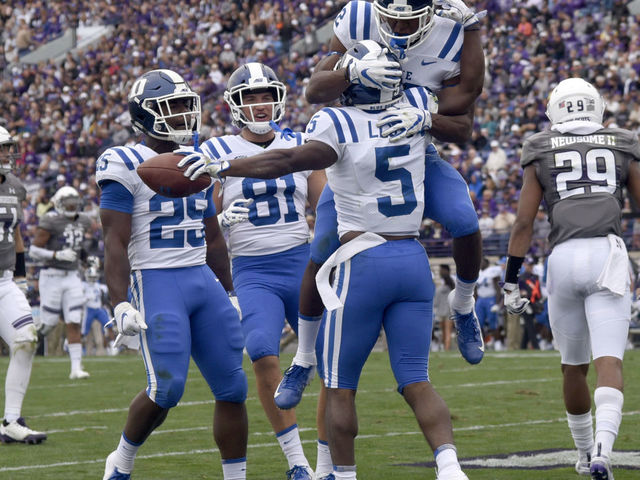 EVANSTON, IL- SEPTEMBER 08: Johnathan Lloyd #5 of the Duke Blue Devils celebrates his touchdown with his teammates against the Northwestern Wildcats during the first half on September 8, 2018 at Ryan Field in Evanston, Illinois.