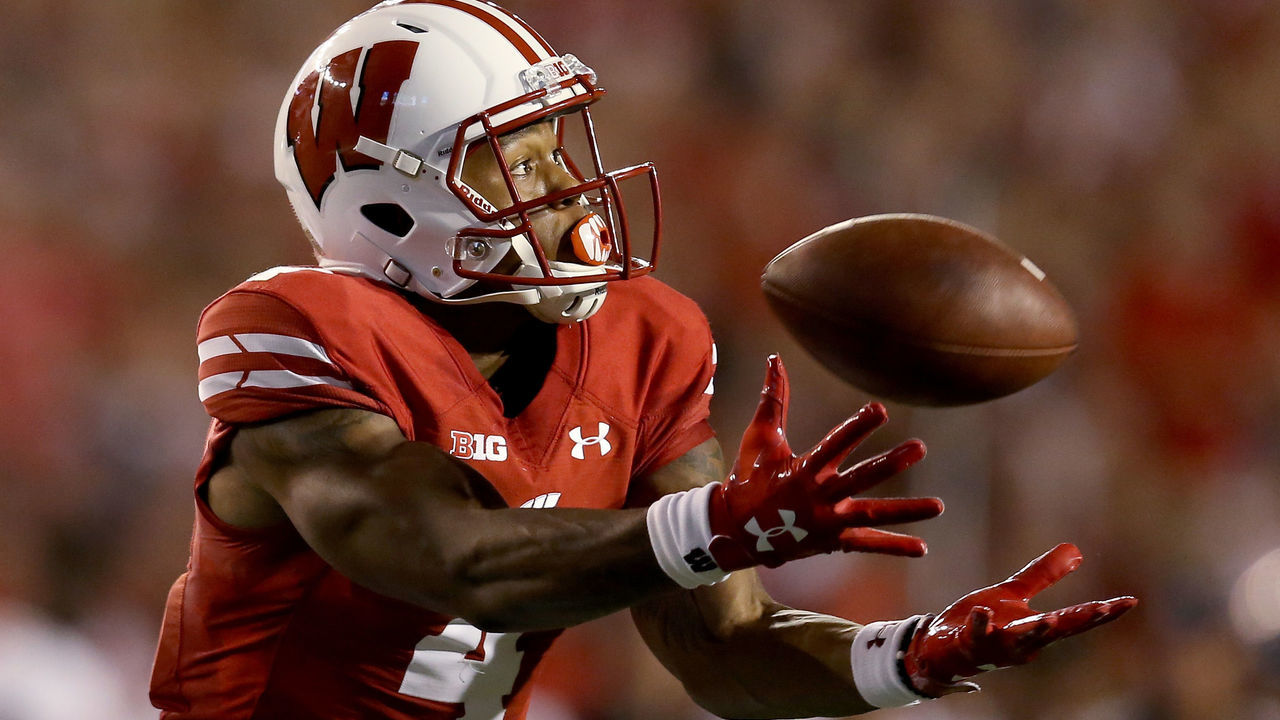 MADISON, WI - AUGUST 31: A.J. Taylor #4 of the Wisconsin Badgers attempts to catch a pass in the second quarter against the Western Kentucky Hilltoppers at Camp Randall Stadium on August 31, 2018 in Madison, Wisconsin.