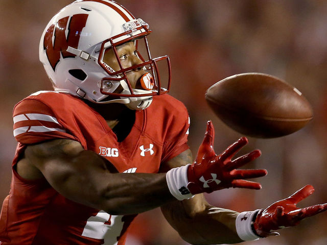 MADISON, WI - AUGUST 31: A.J. Taylor #4 of the Wisconsin Badgers attempts to catch a pass in the second quarter against the Western Kentucky Hilltoppers at Camp Randall Stadium on August 31, 2018 in Madison, Wisconsin.
