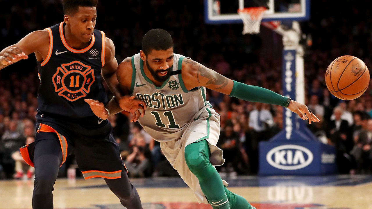 NEW YORK, NY - FEBRUARY 24: Kyrie Irving #11 of the Boston Celtics tries to get past Frank Ntilikina #11 of the New York Knicks at Madison Square Garden on February 24,2018 in New York City.