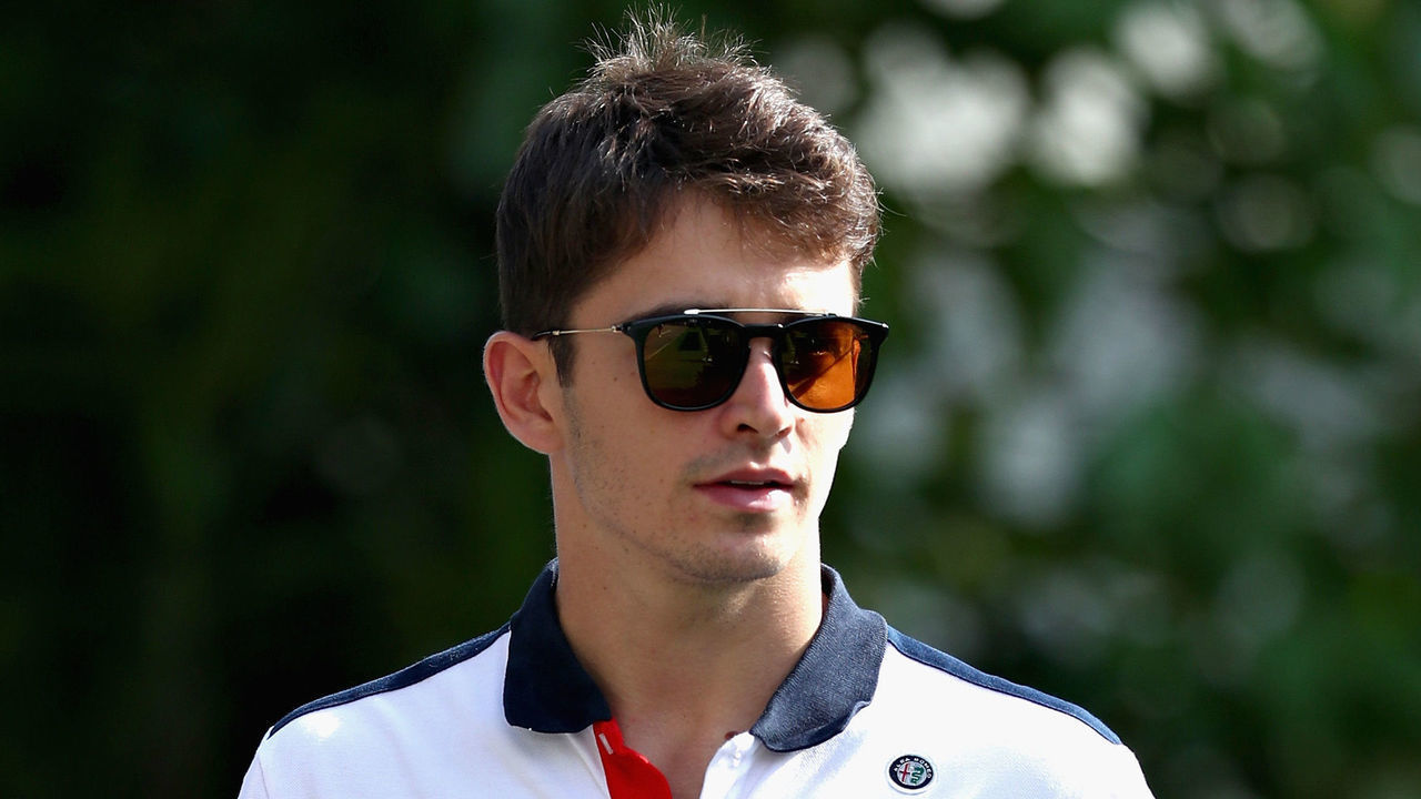SINGAPORE - SEPTEMBER 13: Charles Leclerc of Monaco and Sauber F1 walks in the Paddock during previews ahead of the Formula One Grand Prix of Singapore at Marina Bay Street Circuit on September 13, 2018 in Singapore.
