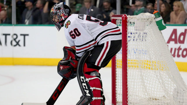 DALLAS, TX - DECEMBER 21: Corey Crawford #50 of the Chicago Blackhawks reacts after giving up a goal against the Dallas Stars in the first period at American Airlines Center on December 21, 2017 in Dallas, Texas.