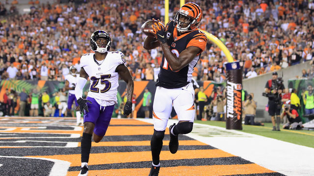 CINCINNATI, OH - SEPTEMBER 13: A.J. Green #18 of the Cincinnati Bengals scores a touchdown against Tavon Young #25 of the Baltimore Ravens during the first quarter at Paul Brown Stadium on September 13, 2018 in Cincinnati, Ohio.