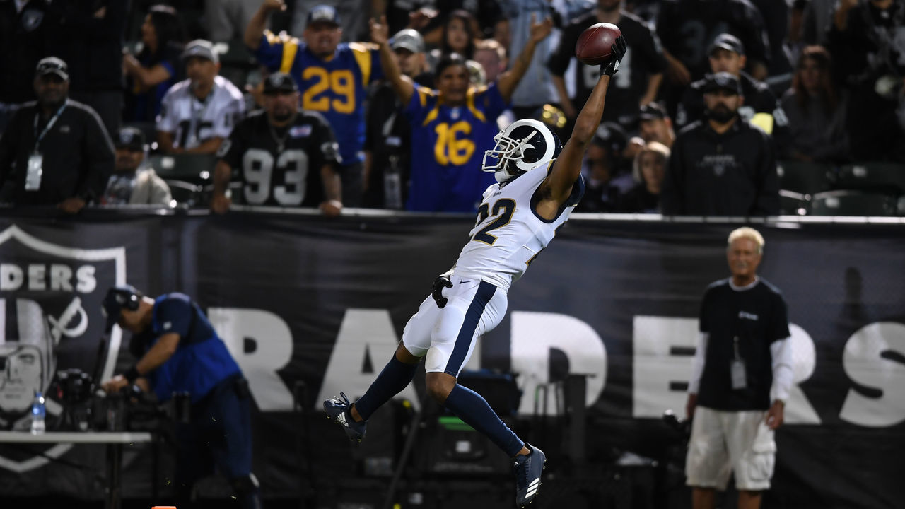 OAKLAND, CA - SEPTEMBER 10: Marcus Peters #22 of the Los Angeles Rams dives into the endzone after an interception of Derek Carr #4 of the Oakland Raiders in the fourth quarter of their NFL game at Oakland-Alameda County Coliseum on September 10, 2018 in Oakland, California.