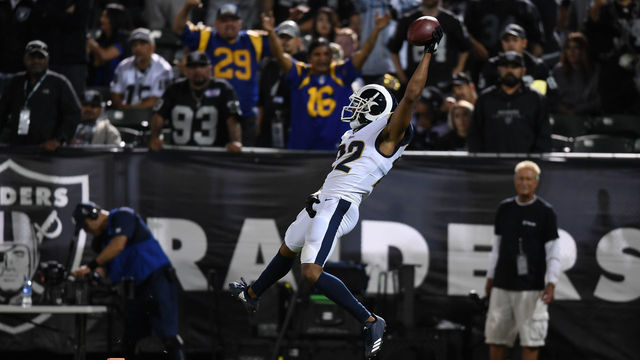 OAKLAND, CA - SEPTEMBER 10: Marcus Peters #22 of the Los Angeles Rams dives into the endzone after an interception of Derek Carr #4 of the Oakland Raiders in the fourth quarter of their NFL game at Oakland-Alameda County Coliseum on September 10, 2018 in Oakland, California.