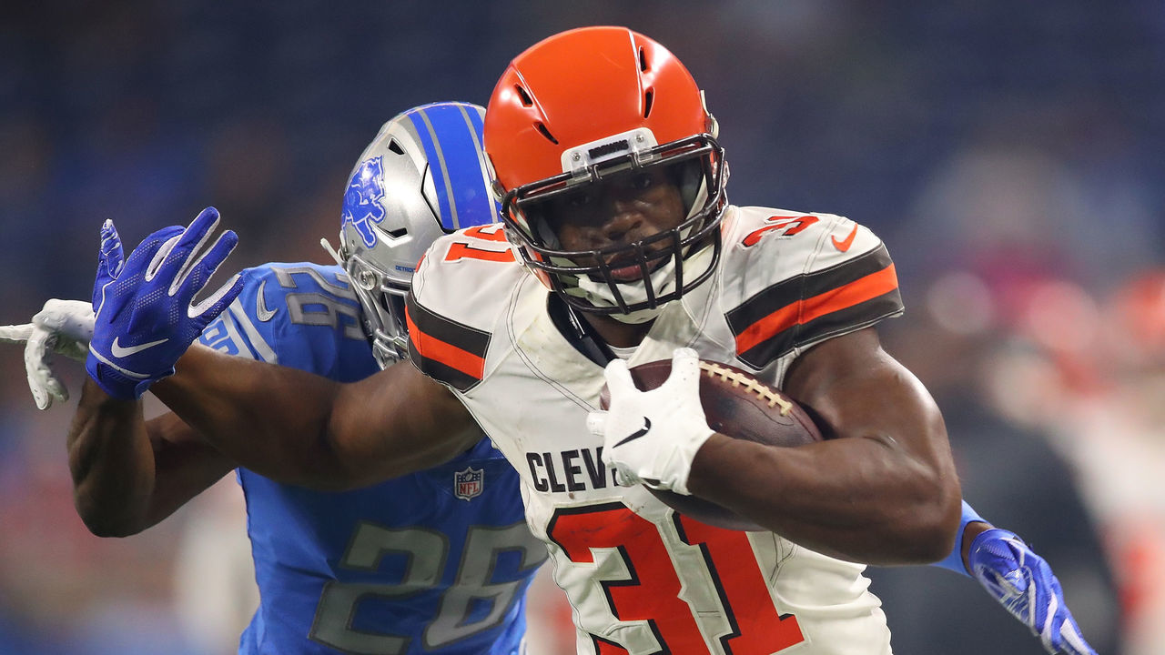 DETROIT, MI - AUGUST 30: Nick Chubb #31 of the Cleveland Browns tries to escape the tackle of DeShawn Shead #26 of the Detroit Lions during a preseason game at Ford Field on August 30, 2018 in Detroit, Michigan.