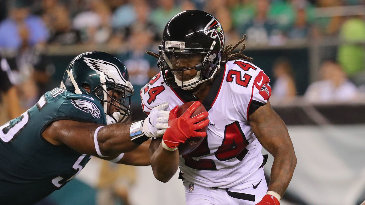 PHILADELPHIA, PA - SEPTEMBER 06: Devonta Freeman #24 of the Atlanta Falcons is tackled by Brandon Graham #55 of the Philadelphia Eagles during the first half at Lincoln Financial Field on September 6, 2018 in Philadelphia, Pennsylvania.