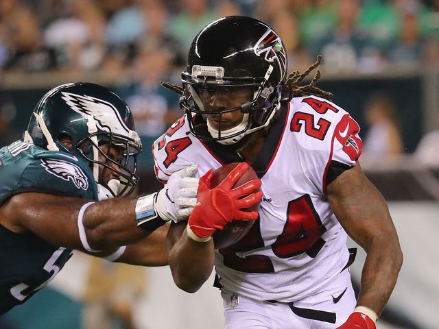 PHILADELPHIA, PA - SEPTEMBER 06: Devonta Freeman #24 of the Atlanta Falcons is tackled by Brandon Graham #55 of the Philadelphia Eagles during the first half at Lincoln Financial Field on September 6, 2018 in Philadelphia, Pennsylvania.
