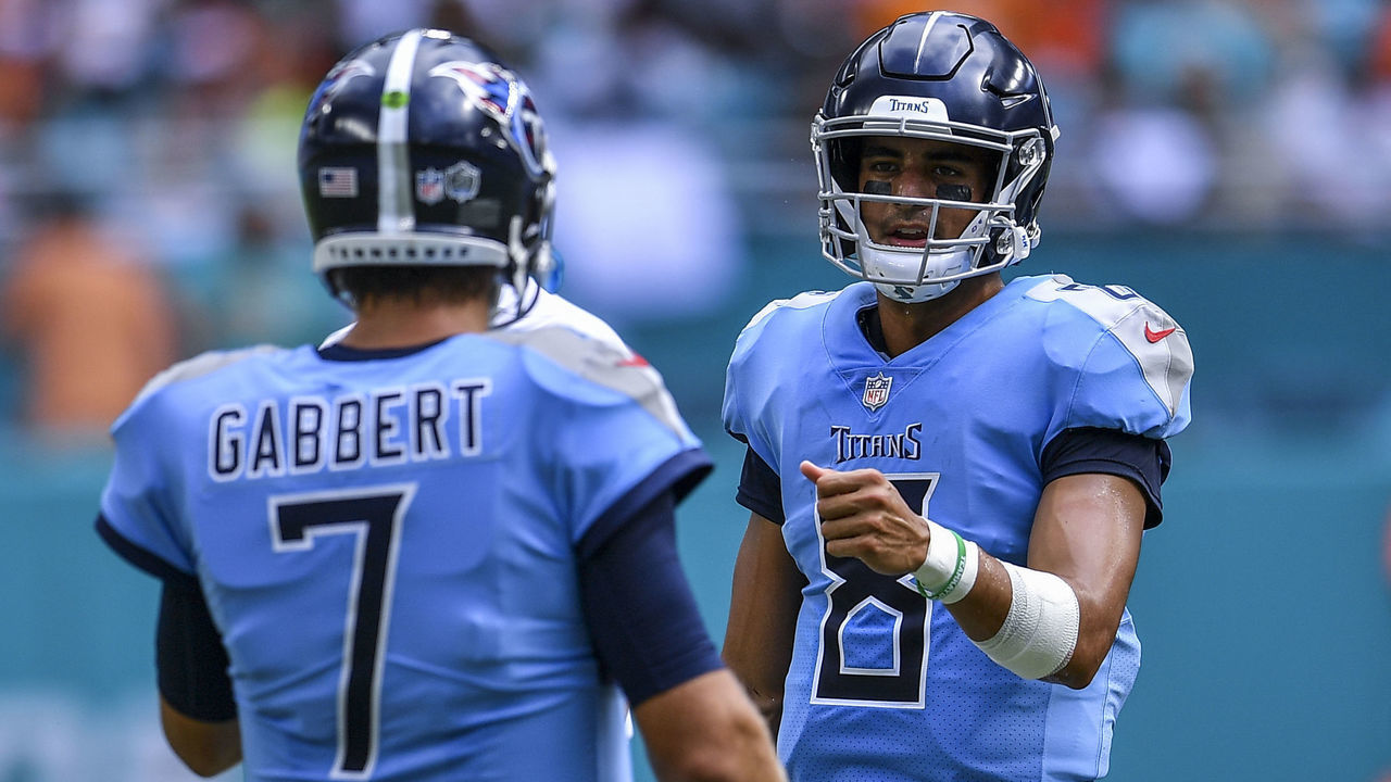 MIAMI, FL - SEPTEMBER 09: Marcus Mariota high fives Blaine Gabbert #7 of the Tennessee Titans after entering the game against the Miami Dolphins at Hard Rock Stadium on September 9, 2018 in Miami, Florida.