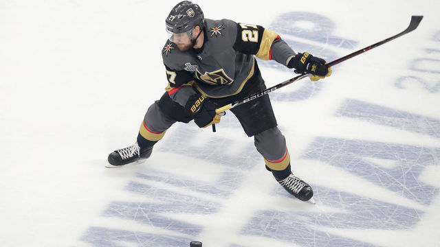 LAS VEGAS, NV - MAY 30: Shea Theodore #27 of the Vegas Golden Knights handles the puck against the Washington Capitals in Game Two of the 2018 NHL Stanley Cup Final at T-Mobile Arena on May 30, 2018 in Las Vegas, Nevada.
