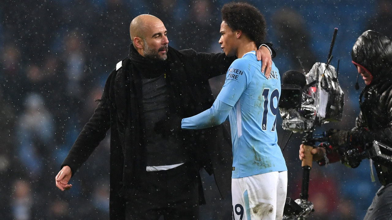 MANCHESTER, ENGLAND - MARCH 04: Josep Guardiola, Manager of Manchester City and Leroy Sane speak following the Premier League match between Manchester City and Chelsea at Etihad Stadium on March 4, 2018 in Manchester, England.