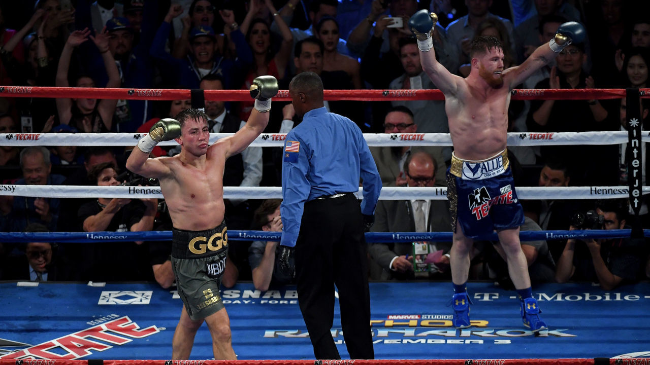 LAS VEGAS, NV - SEPTEMBER 16: (L-R) Gennady Golovkin and Canelo Alvarez both celebrate after the final round in their WBC, WBA and IBF middleweight championship bout at T-Mobile Arena on September 16, 2017 in Las Vegas, Nevada.