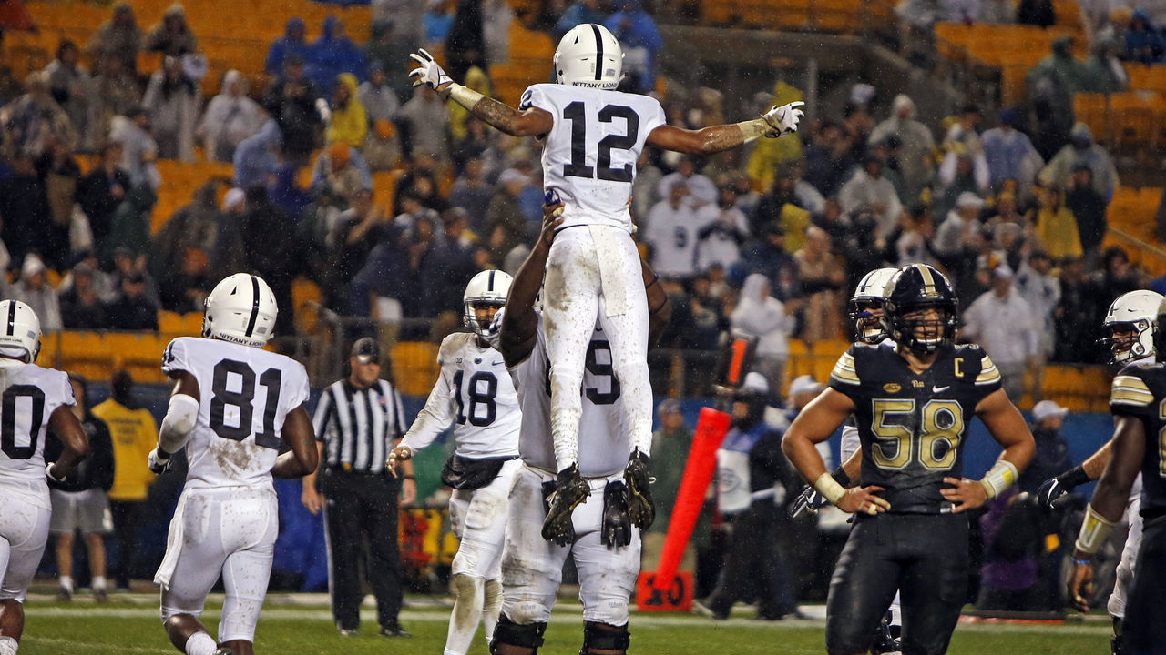 PITTSBURGH, PA - SEPTEMBER 08: Mac Hippenhammer #12 of the Penn State Nittany Lions celebrates with C.J. Thorpe #69 of the Penn State Nittany Lions after catching a 11 yard touchdown pass against the Pittsburgh Panthers in the fourth quarter on September 8, 2018 at Heinz Field in Pittsburgh, Pennsylvania.