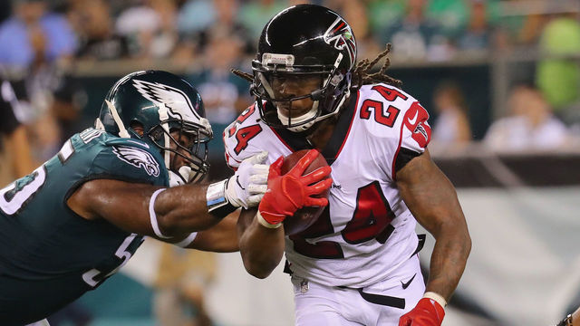 PHILADELPHIA, PA - SEPTEMBER 06: Devonta Freeman #24 of the Atlanta Falcons is tackled by Brandon Graham #55 of the Philadelphia Eagles during the first half at Lincoln Financial Field on September 6, 2018 in Philadelphia, Pennsylvania.
