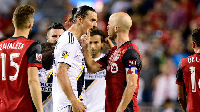 TORONTO, ON - SEPTEMBER 15: Zlatan Ibrahimovic (9) of LA Galaxy argues with Michael Bradley (4) of Toronto FC during the second half of the MLS regular season match between Toronto FC and LA Galaxy on September 15, 2018, at BMO Field in Toronto, ON, Canada. (Photograph by Julian Avram/Icon Sportswire via Getty Images)