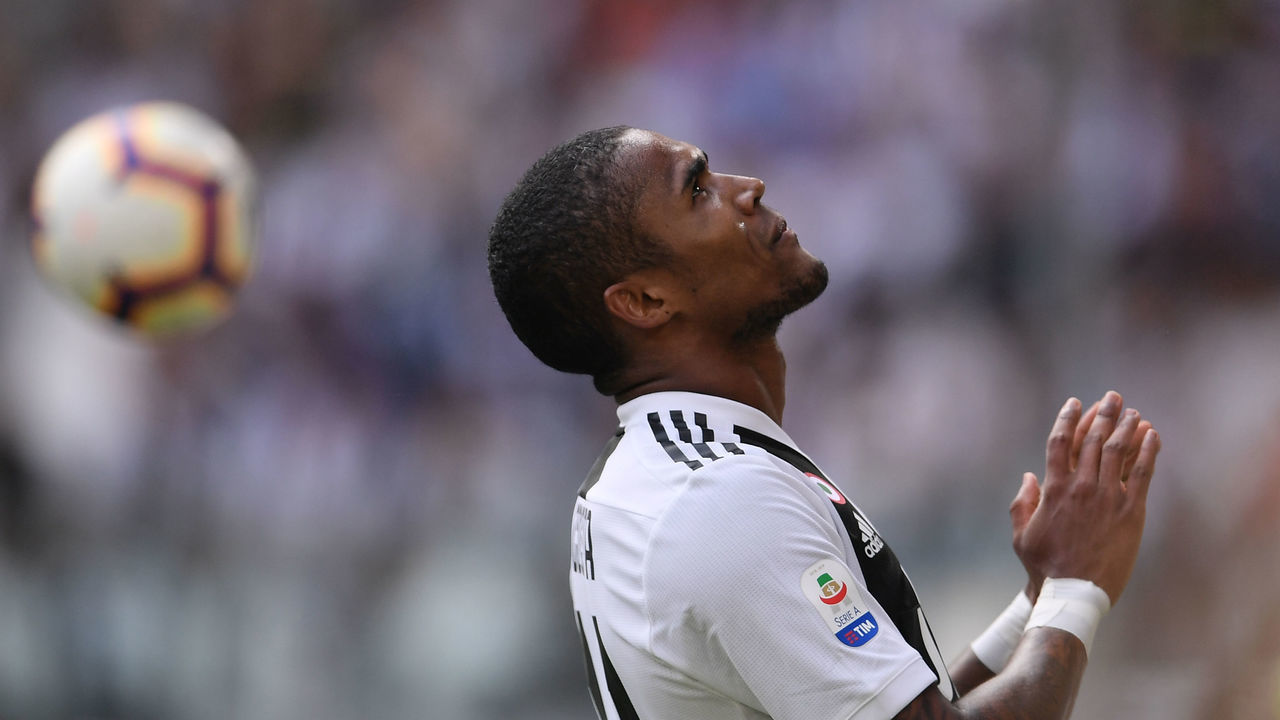 Juventus' Brazilian forward Douglas Costa reacts during the Italian Serie A football match Juventus vs Sassuolo on September 16, 2018 at the Juventus stadium in Turin.