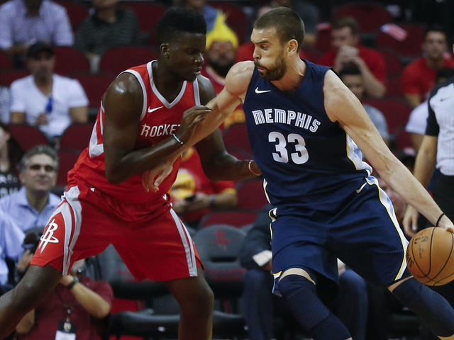 HOUSTON, TX - OCTOBER 23: Marc Gasol #33 of the Memphis Grizzlies drives on Clint Capela #15 of the Houston Rockets at Toyota Center on October 23, 2017 in Houston, Texas.