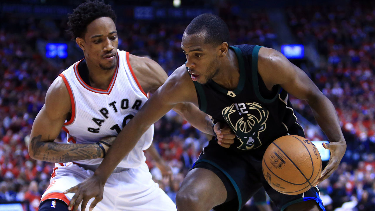 TORONTO, ON - APRIL 24: Khris Middleton #22 of the Milwaukee Bucks dribbles the ball as DeMar DeRozan #10 of the Toronto Raptors defends in the second half of Game Five of the Eastern Conference Quarterfinals during the 2017 NBA Playoffs at Air Canada Centre on April 24, 2017 in Toronto, Canada.