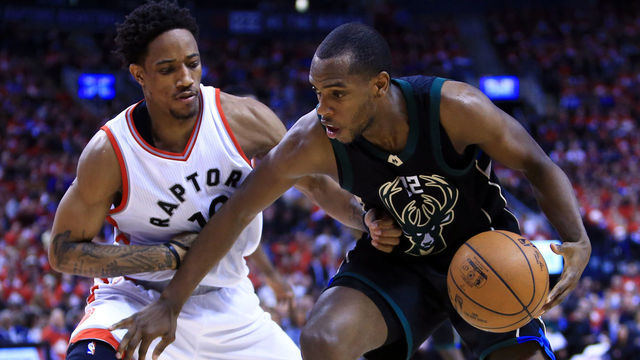 TORONTO, ON - APRIL 24: Khris Middleton #22 of the Milwaukee Bucks dribbles the ball as DeMar DeRozan #10 of the Toronto Raptors defends in the second half of Game Five of the Eastern Conference Quarterfinals during the 2017 NBA Playoffs at Air Canada Centre on April 24, 2017 in Toronto, Canada.