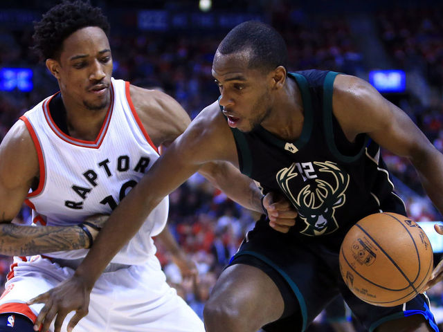 TORONTO, ON - APRIL 24: Khris Middleton #22 of the Milwaukee Bucks dribbles the ball as DeMar DeRozan #10 of the Toronto Raptors defends in the second half of Game Five of the Eastern Conference Quarterfinals during the 2017 NBA Playoffs at Air Canada Centre on April 24, 2017 in Toronto, Canada.