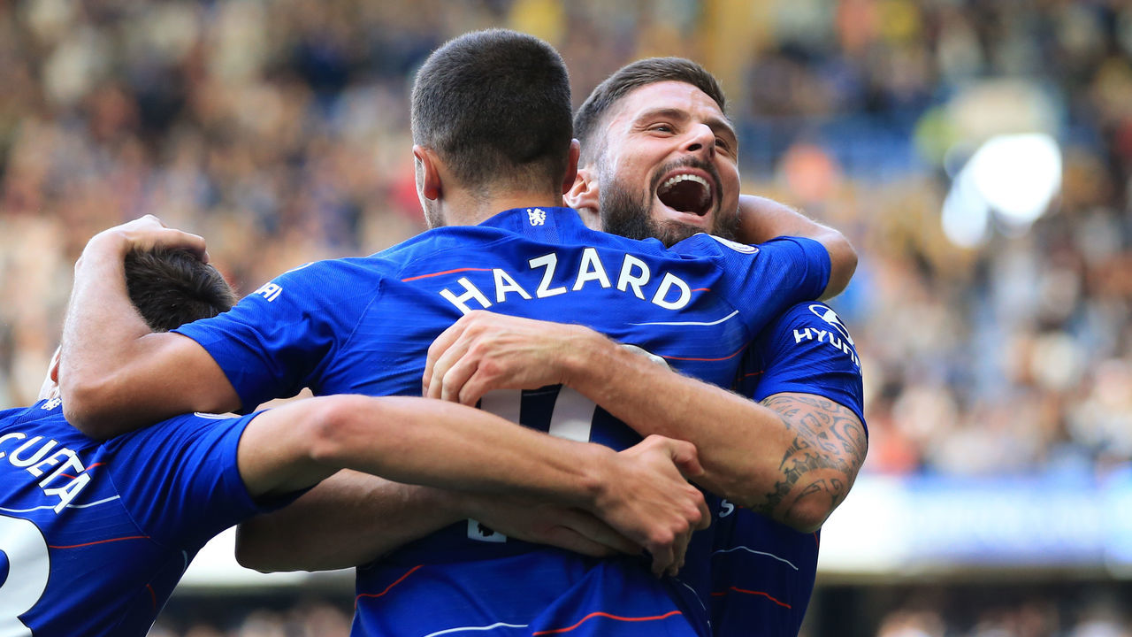 LONDON, ENGLAND - SEPTEMBER 15: Eden Hazard of Chelsea celebrates with teammate Olivier Giroud after scoring his team's first goal during the Premier League match between Chelsea FC and Cardiff City at Stamford Bridge on September 15, 2018 in London, United Kingdom.