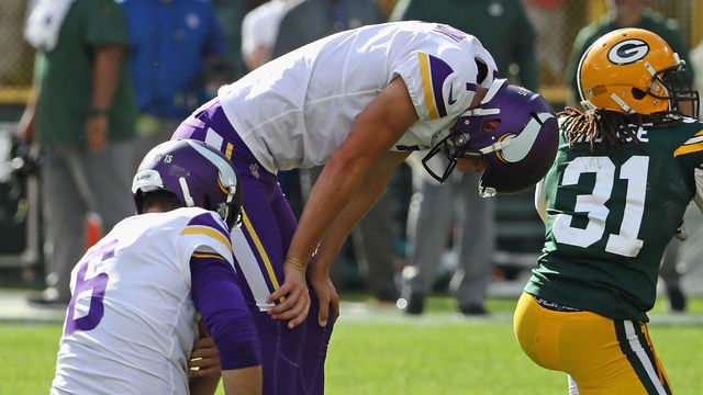 GREEN BAY, WI - SEPTEMBER 16: Daniel Carlson #7 of the Minnesota Vikings (R) reacts after missing a potential game-winning field goal in overtime against the Green Bay Packers at Lambeau Field on September 16, 2018 in Green Bay, Wisconsin. The Vikings and the Packers tied 29-29 after overtime.