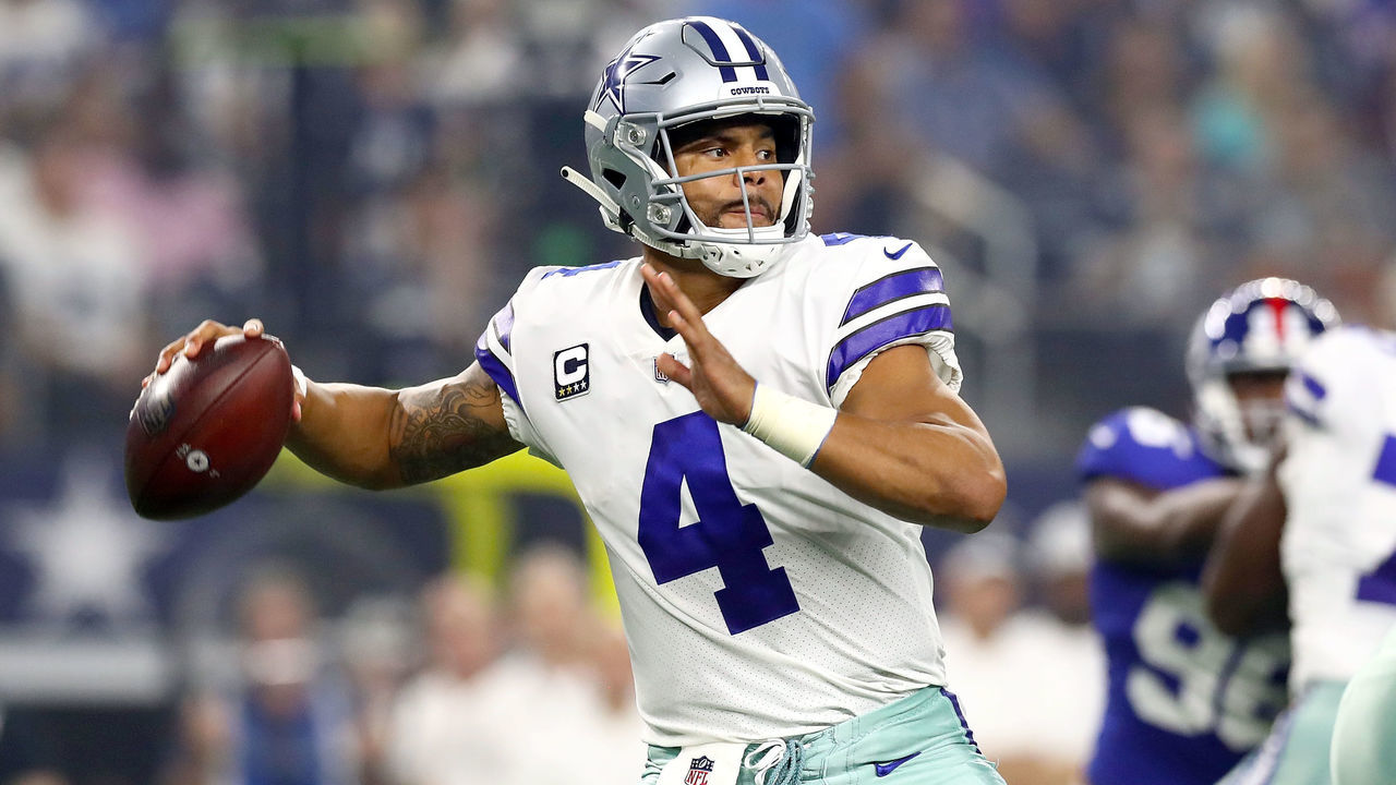 ARLINGTON, TX - SEPTEMBER 16: Dak Prescott #4 of the Dallas Cowboys looks to pass against the New York Giants in the first quarter of a football game at AT&T Stadium on September 16, 2018 in Arlington, Texas.