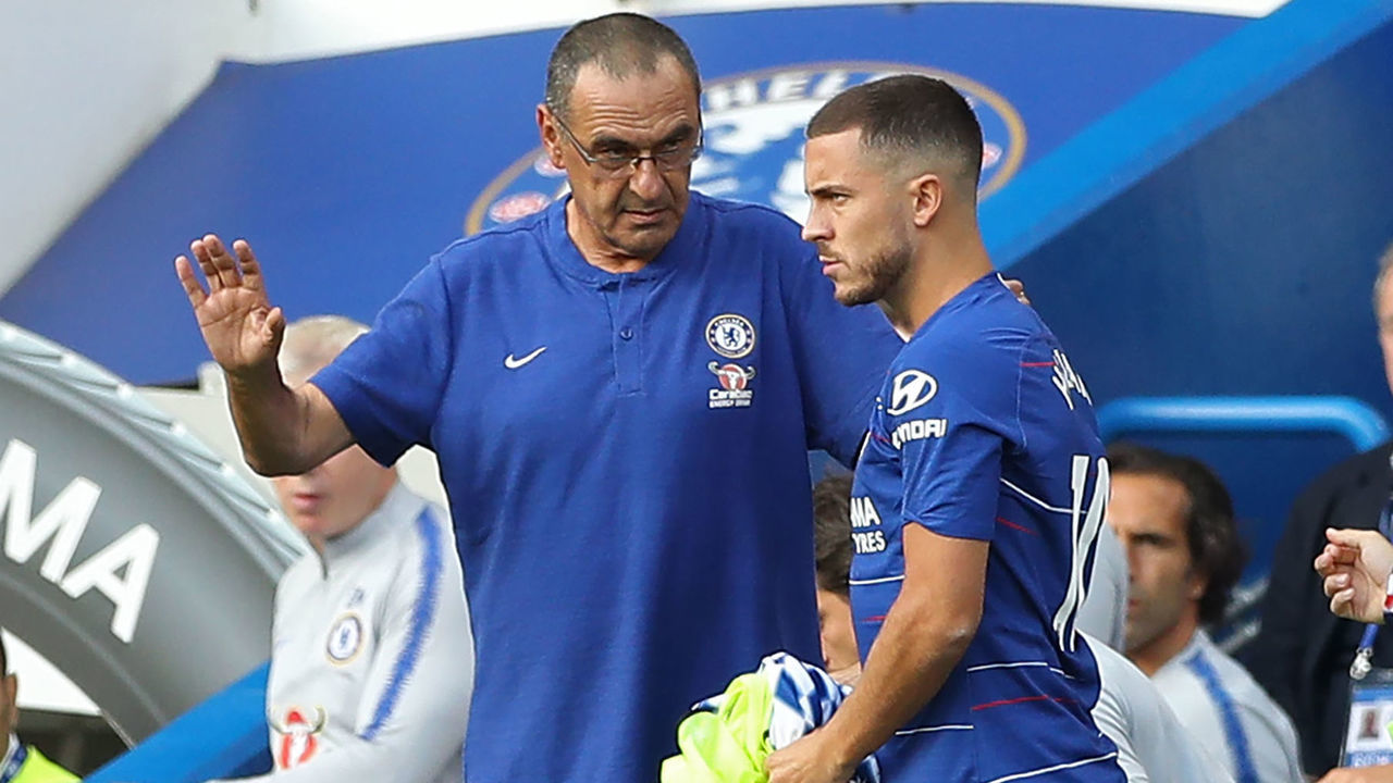 Chelsea's Italian head coach Maurizio Sarri (L) prepares to bring on Chelsea's Belgian midfielder Eden Hazard (C) and Chelsea's Croatian midfielder Mateo Kovacic (R) during the English Premier League football match between Chelsea and Arsenal at Stamford Bridge in London on August 18, 2018.