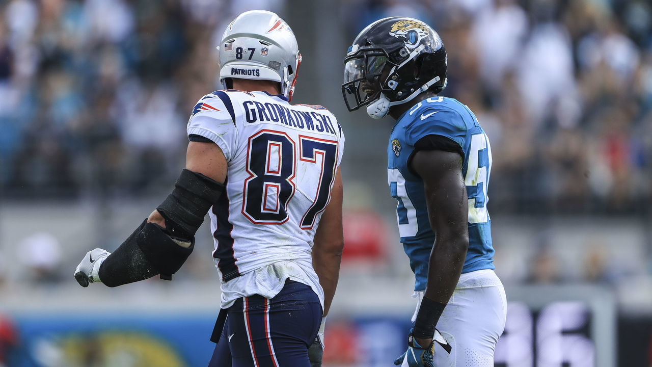 JACKSONVILLE, FL - SEPTEMBER 16: Rob Gronkowski #87 of the New England Patriots and Telvin Smith Sr. #50 of the Jacksonville Jaguars exchange words in the first quarter at TIAA Bank Field on September 16, 2018 in Jacksonville, Florida.