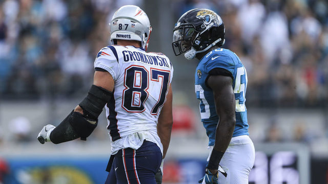 JACKSONVILLE, FL - SEPTEMBER 16: Rob Gronkowski #87 of the New England Patriots and Telvin Smith Sr. #50 of the Jacksonville Jaguars exchange words in the first quarter at TIAA Bank Field on September 16, 2018 in Jacksonville, Florida.