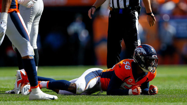 DENVER, CO - SEPTEMBER 16: Linebacker Von Miller #58 of the Denver Broncos celebrates by crawling on the ground after a sack forcing fourth down in the second quarter of a game against the Oakland Raiders at Broncos Stadium at Mile High on September 16, 2018 in Denver, Colorado.