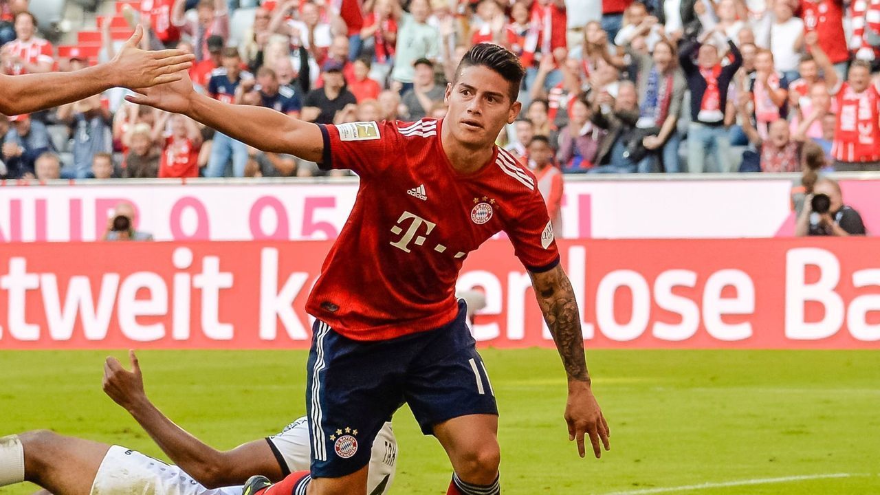 Bayern Munich's Columbian midfielder James Rodriguez (R) celebrates his goal during the German First division Bundesliga football match between FC Bayern Munich and Bayer Leverkusen in Munich, on September 15, 2018.