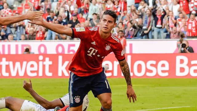 Bayern Munich's Columbian midfielder James Rodriguez (R) celebrates his goal during the German First division Bundesliga football match between FC Bayern Munich and Bayer Leverkusen in Munich, on September 15, 2018.