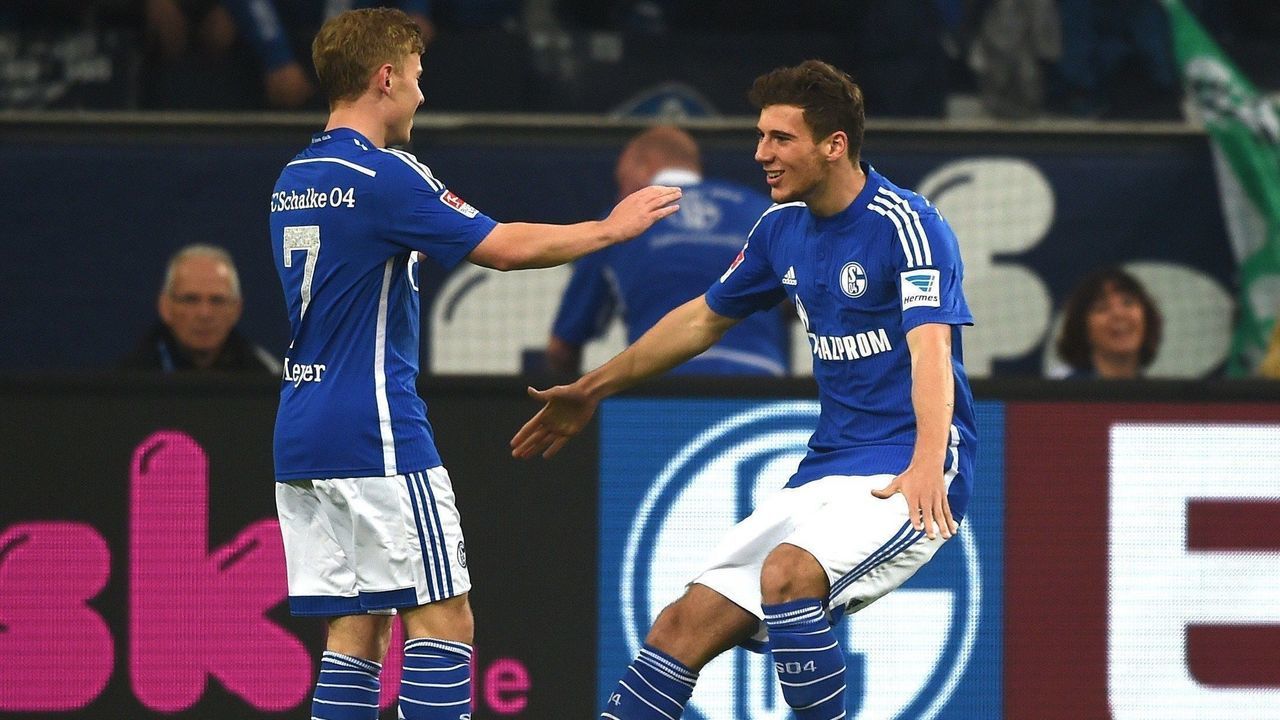 Schalke's midfielder Max Meyer and Schalke's midfielder Leon Goretzka celebrate after their team scored during the German first division Bundesliga football match FC Schalke 04 vs 1 FC Nuremberg in Gelsenkirchen, western Germany on May 10, 2014. AFP PHOTO / PATRIK STOLLARZ DFL RULES TO LIMIT THE ONLINE USAGE DURING MATCH TIME TO 15 PICTURES PER MATCH. FOR FURTHER QUERIES PLEASE CONTACT DFL DIRECTLY AT + 49 69 650050.