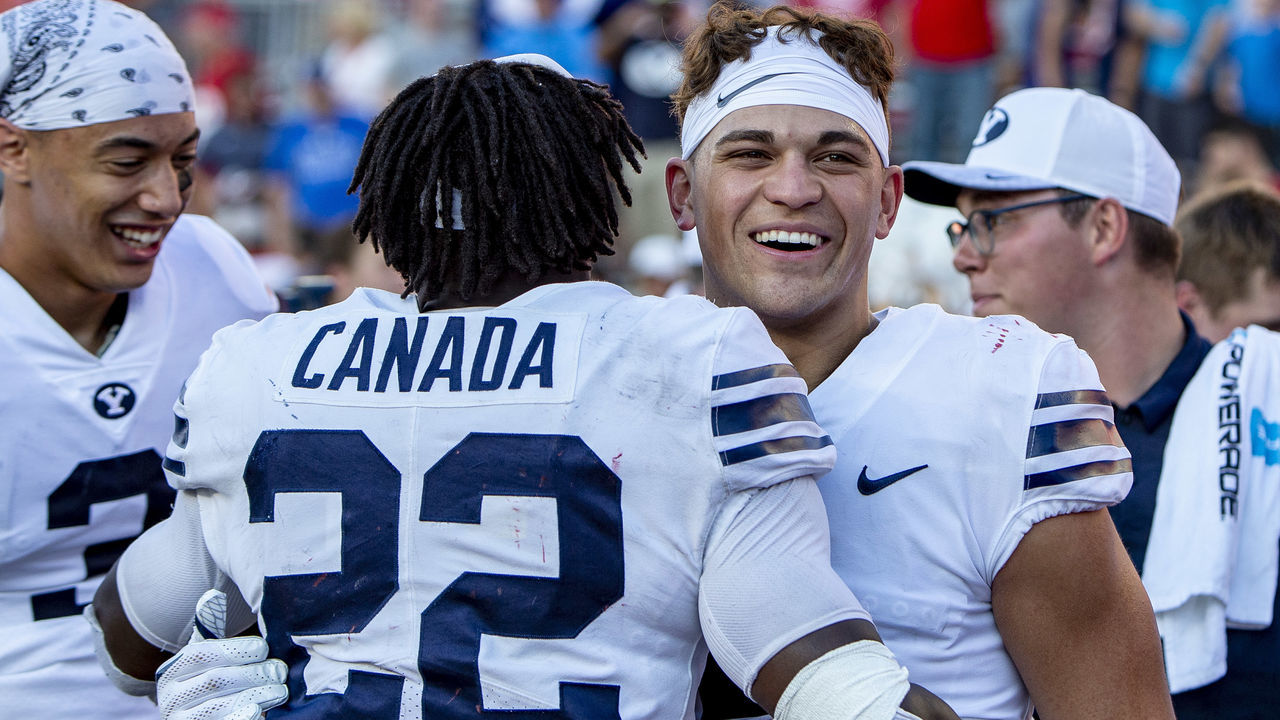 MADISON, WI - SEPTEMBER 15: BYU Cougars running back Squally Canada (22) celebrates with BYU Cougars running back Lopini Katoa (4) after upsetting the 6th ranked Wisconsin Badgers after an college football game between the New Mexico Lobos and the Wisconsin Badgers on September 15th, 2018 at the Camp Randall Stadium in Madison, WI. BYU upsets 6th ranked Wisconsin 24-21.