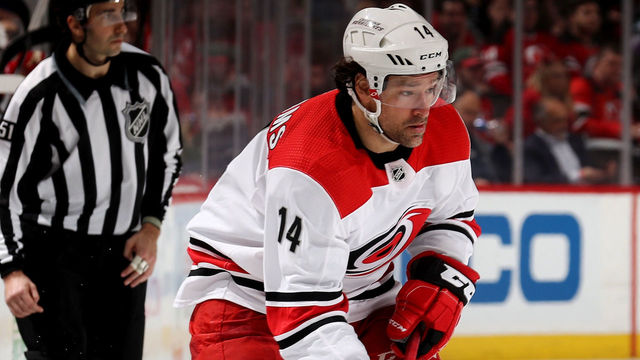 NEWARK, NJ - FEBRUARY 15: Justin Williams #14 of the Carolina Hurricanes looks to pass against the New Jersey Devils on February 15, 2018 at Prudential Center in Newark, New Jersey.The New Jersey Devils defeated the Carolina Hurricanes 5-2.