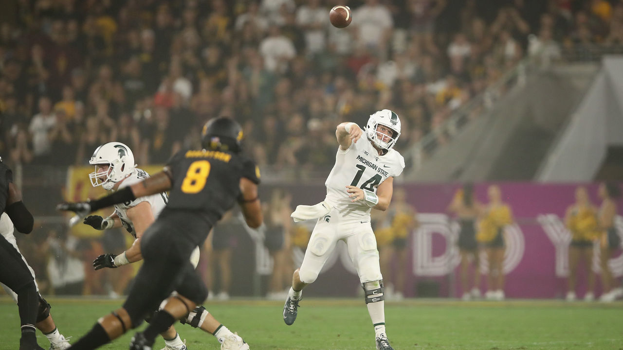 TEMPE, AZ - SEPTEMBER 08: Quarterback Brian Lewerke #14 of the Michigan State Spartans drops back to pass during the college football game against the Arizona State Sun Devils at Sun Devil Stadium on September 8, 2018 in Tempe, Arizona. The Sun Devils defeated the Spartans 16-13.