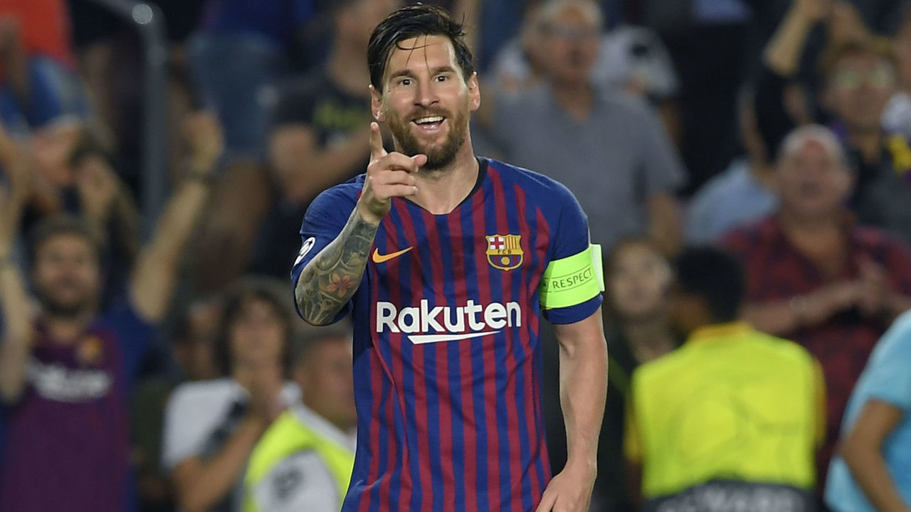 Barcelona's Argentinian forward Lionel Messi celebrates after scoring his third goal during the UEFA Champions' League group B football match FC Barcelona against PSV Eindhoven at the Camp Nou stadium in Barcelona on September 18, 2018.