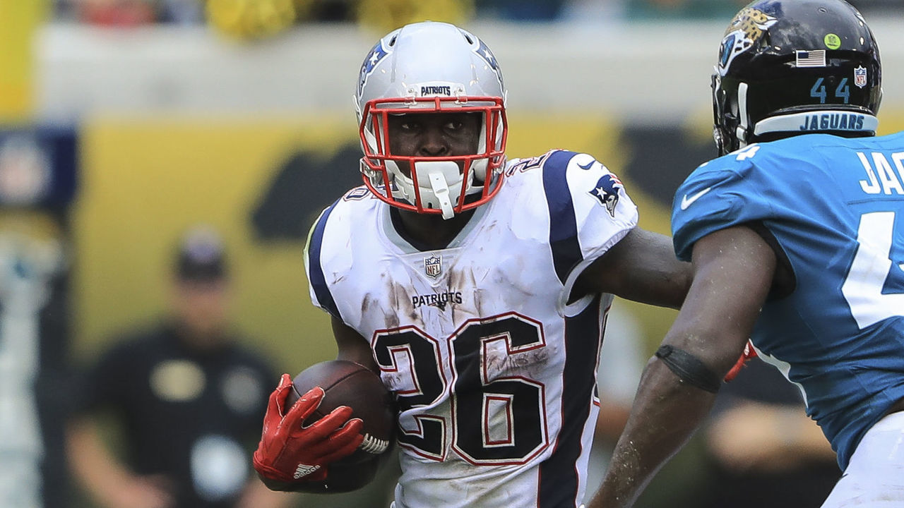 JACKSONVILLE, FL - SEPTEMBER 16: Sony Michel #26 of the New England Patriots runs with the ball in the first half against the Jacksonville Jaguars at TIAA Bank Field on September 16, 2018 in Jacksonville, Florida.