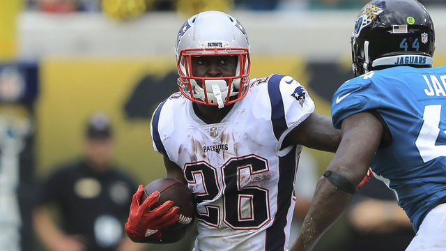 JACKSONVILLE, FL - SEPTEMBER 16: Sony Michel #26 of the New England Patriots runs with the ball in the first half against the Jacksonville Jaguars at TIAA Bank Field on September 16, 2018 in Jacksonville, Florida.