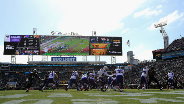 JACKSONVILLE, FL - JANUARY 07: Quarterback Tyrod Taylor #5 of the Buffalo Bills hands the ball off to fullback Mike Tolbert #35 in the first quarter against the Jacksonville Jaguars during the AFC Wild Card Playoff game at EverBank Field on January 7, 2018 in Jacksonville, Florida.