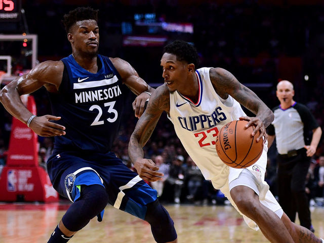 LOS ANGELES, CA - DECEMBER 06: Lou Williams #23 of the LA Clippers drives to the basket on Jimmy Butler #23 of the Minnesota Timberwolves during a 113-107 Timberwolves win at Staples Center on December 6, 2017 in Los Angeles, California.
