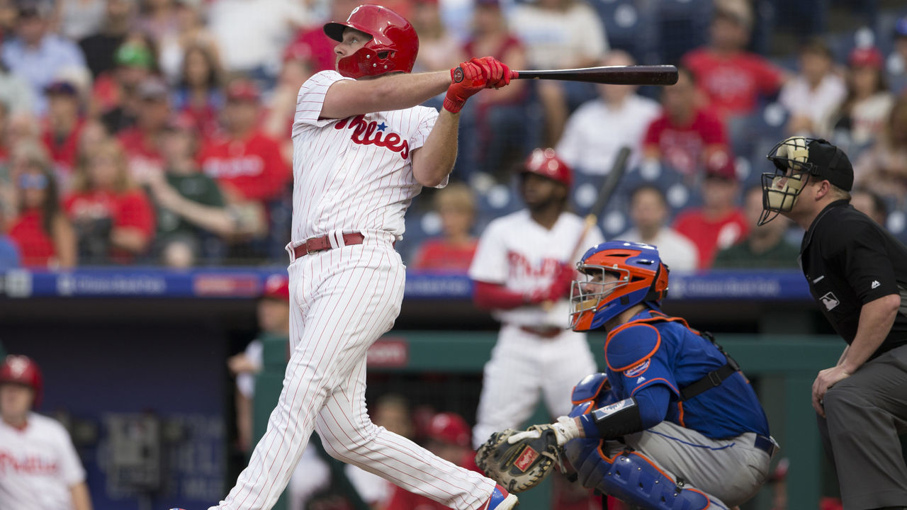 PHILADELPHIA, PA - SEPTEMBER 19: Rhys Hoskins #17 of the Philadelphia Phillies hits a solo home run in the bottom of the first inning against the New York Mets at Citizens Bank Park on September 19, 2018 in Philadelphia, Pennsylvania.