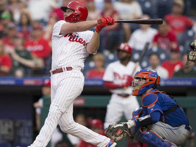 PHILADELPHIA, PA - SEPTEMBER 19: Rhys Hoskins #17 of the Philadelphia Phillies hits a solo home run in the bottom of the first inning against the New York Mets at Citizens Bank Park on September 19, 2018 in Philadelphia, Pennsylvania.