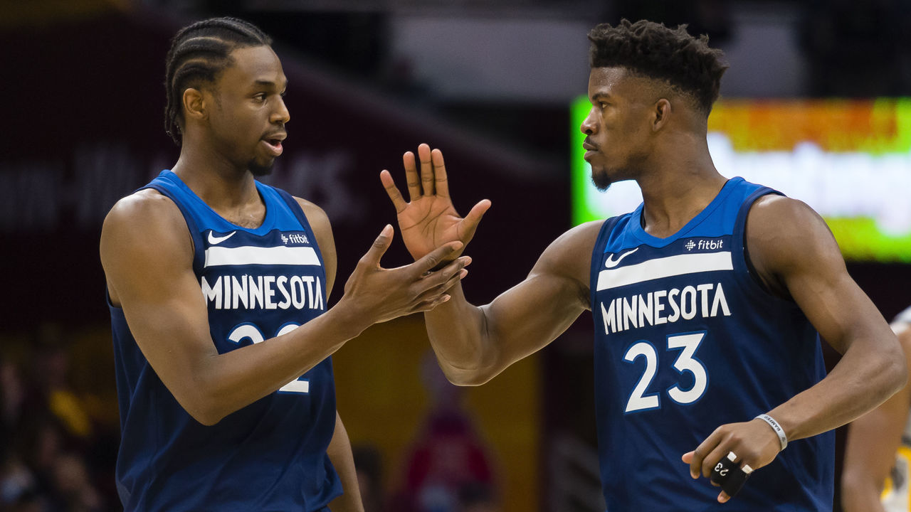 CLEVELAND, OH - FEBRUARY 7: Andrew Wiggins #22 and Jimmy Butler #23 of the Minnesota Timberwolves celebrate after scoring during the second half against the Cleveland Cavaliers at Quicken Loans Arena on February 7, 2018 in Cleveland, Ohio. The Cavaliers defeated the Timberwolves 140-138 in overtime.