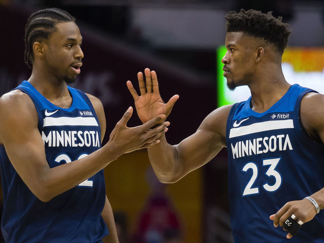 CLEVELAND, OH - FEBRUARY 7: Andrew Wiggins #22 and Jimmy Butler #23 of the Minnesota Timberwolves celebrate after scoring during the second half against the Cleveland Cavaliers at Quicken Loans Arena on February 7, 2018 in Cleveland, Ohio. The Cavaliers defeated the Timberwolves 140-138 in overtime.