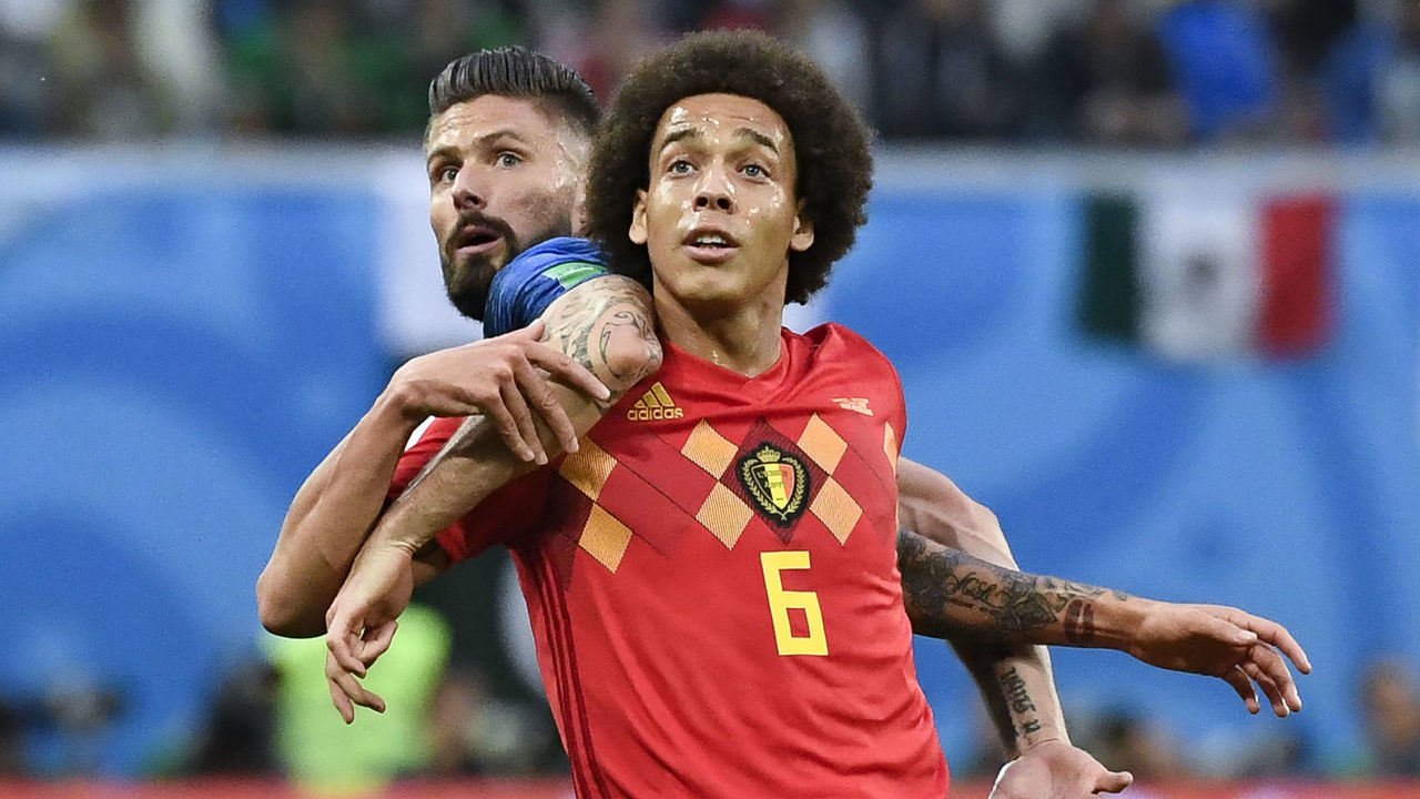 Belgium's midfielder Axel Witsel (R) vies with France's forward Olivier Giroud during the Russia 2018 World Cup semi-final football match between France and Belgium at the Saint Petersburg Stadium in Saint Petersburg on July 10, 2018.
